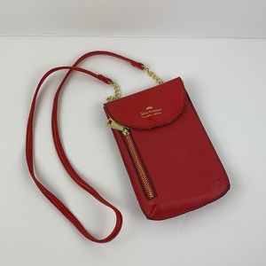 Juicy Couture red small crossbody bag with side zip and snap closure
